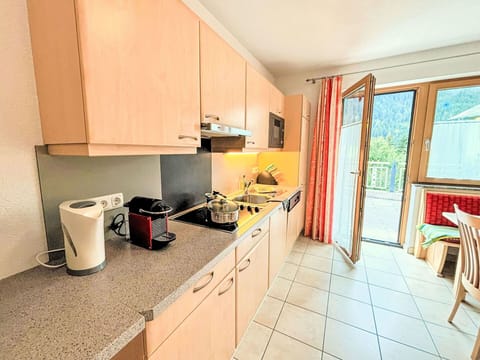 Cabinetry, Property, Window, Countertop, Kitchen Appliance, Kitchen, Kitchen Stove, Wood, Building, Interior Design