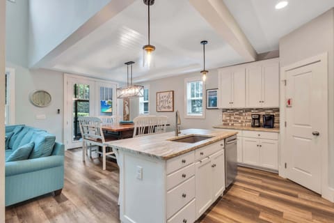 The spacious kitchen at 36 Firethorn Lane is a culinary haven, fully equipped with modern appliances including a stove, microwave, and refrigerator. The thoughtful layout ensures that cooking family meals is a breeze, making it easy to create!