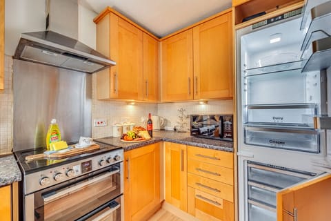 The kitchen is fully equipped with everything you need to prepare a home-cooked mea