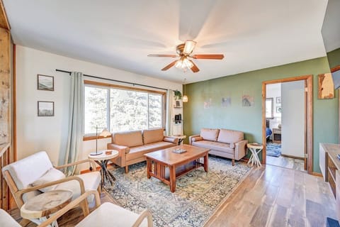 Living Room features expansive views of the Collegiate Peaks and a smart TV. Seasonally we install a window AC unit to help keep the shared space a comfortable temperature. 
