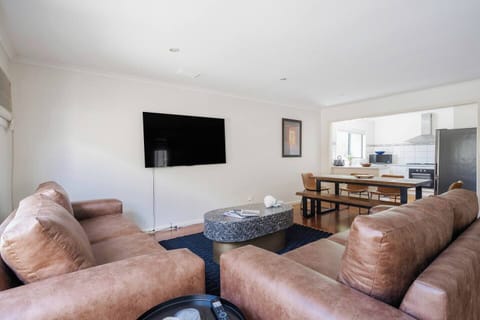 Open plan living creates a seamless transition from the dining area to kitchen, ideal for entertaining. 