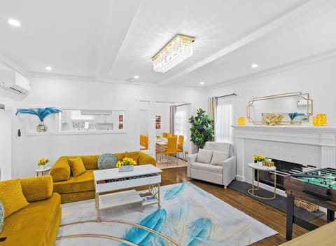 Cozy living room with fireplace, lift-top table, and 10-in-1 game set.