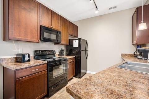 Cabinets come stocked with generous kitchenware, pots/pans, dishes, etc.