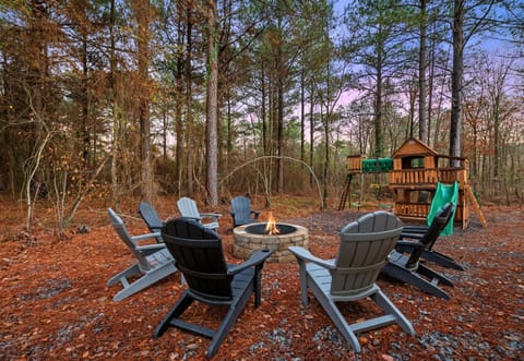 Gather around the inviting fire pit surrounded by towering pines—perfect for roasting marshmallows, storytelling, and unwinding under the stars.