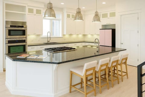 Stylish Chef’s Kitchen w/ Island Seating, Pink Retro Fridge, Natural Light & Modern Appliances