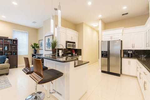 Modern Kitchen with Granite Counters, Stainless Steel Appliances & Stylish Breakfast Bar