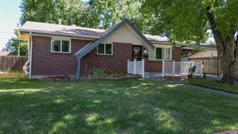 The fenced yard provides privacy and security, making it a perfect space for outdoor activities, relaxation, and pets to roam freely.