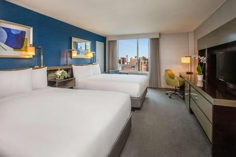 Relax in a stylish double room framed by skyline views.