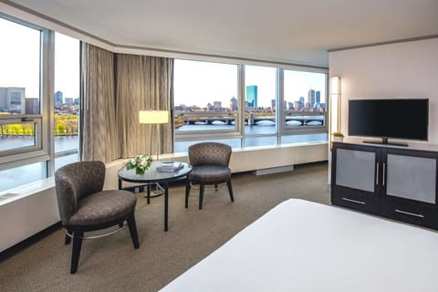 Wake up to sunlit river views from your plush bed.