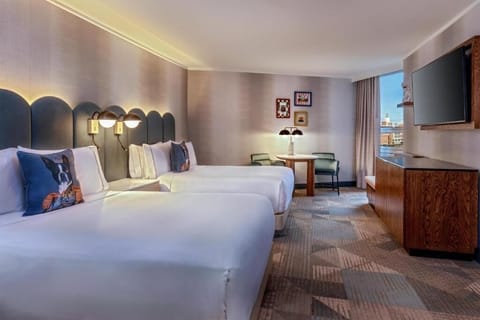 Stretch out comfortably with twin beds and calming city views.