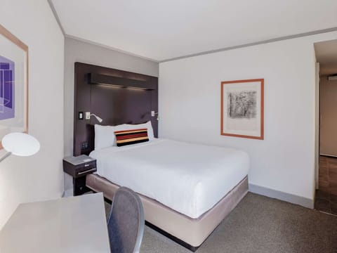 Settle into crisp linens and a peaceful, uncluttered retreat.