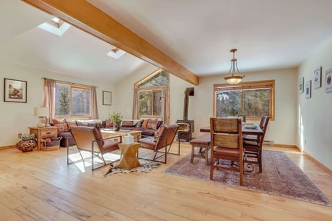 Open Concept Great Room with skylights for natural lighting.  Large seating are with sectional couch and accent chairs for your group.