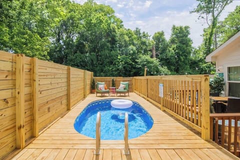 Private Charlotte plunge pool with a sun-filled deck and privacy fencing. Perfect for cooling off after the sauna, relaxing in the sunshine, or enjoying laid-back afternoons together near Uptown.