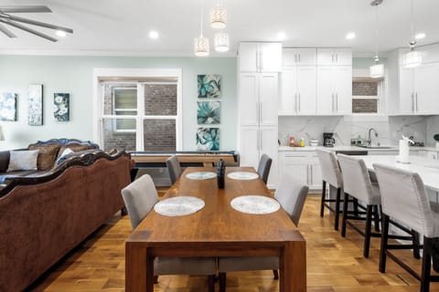 Dining table will accommodate 4 people and 4 people at the island.