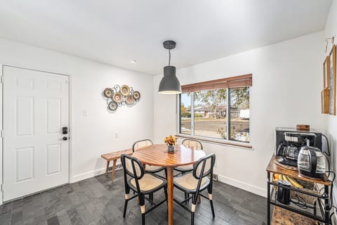 Cozy breakfast nook with natural light, perfect for enjoying your morning coffee or casual meals.