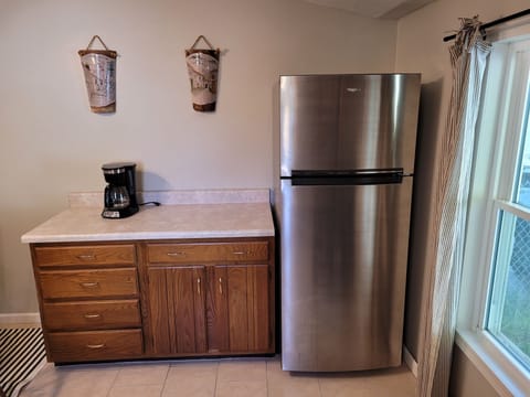 KITCHEN:  The home has a fairly large kitchen with all appliances including a dishwasher.  Also has a good supply of cooking and dining utensils.