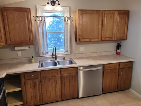 KITCHEN:  The home has a fairly large kitchen with all appliances including a dishwasher.  Also has a good supply of cooking and dining utensils.