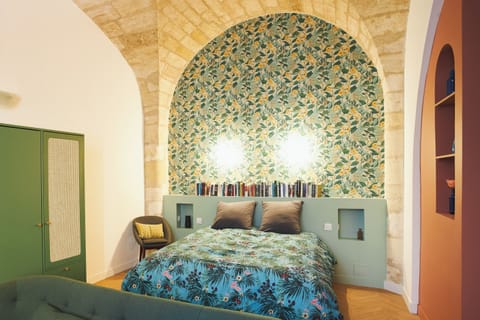 Comfortable queen-size bed featuring niches on either side.