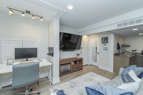 work space w/27" monitor, 1GB wifi, docking cables, power strip, new comfy chair