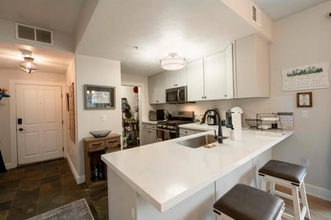 Fully equipped kitchen with additional counter seating.