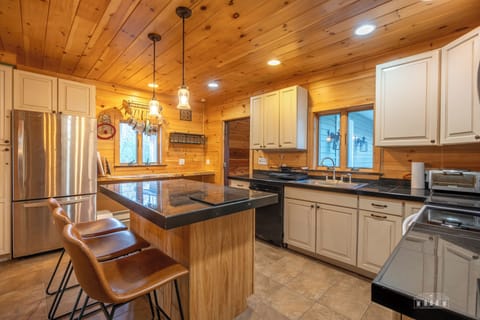 Kitchen with counter and stools