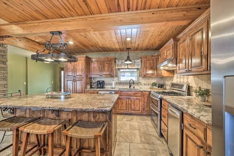 Fully stocked kitchen with bar seating for 4