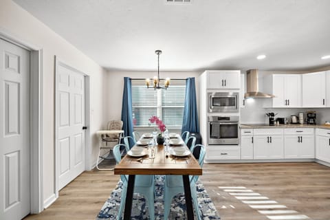 Spacious main dining table that sits 6 with full tableware and silverware included.