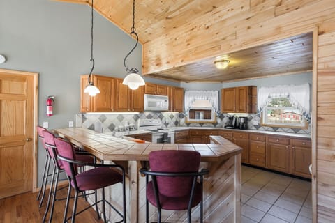 Kitchen - Our fully equipped kitchen with bar seating is perfect for entertaining.