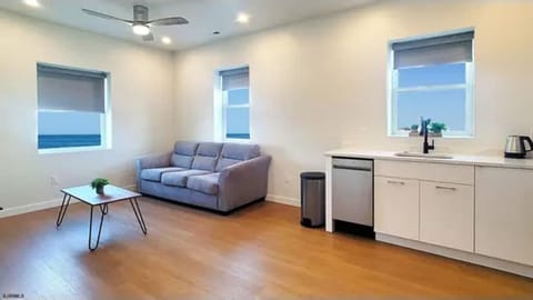 Bright living space with cozy seating and a modern kitchen