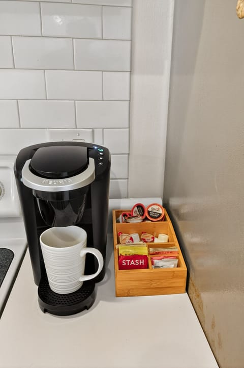 Start your day right at the coffee station — Keurig, mugs, and a variety of blends ready for you.