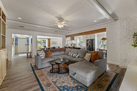 Relax and unwind in the heart of the home, featuring a cozy fireplace, plush seating, and a Smart TV for movie nights.