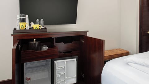 Refresh anytime with convenient mini-fridge and in-room coffee setup.