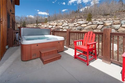 Private deck with outdoor hot tub.
