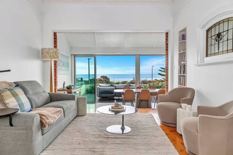 The main living and dining space invites you to relax with breathtaking ocean views and a bright, airy layout.
