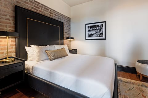 Bedroom 1 - Queen bed featuring a built-in wardrobe and flat-screen TV.