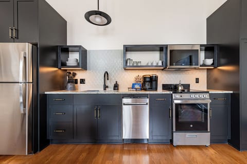 Fully equipped kitchen with modern appliances, offering everything you need for preparing meals or enjoying a morning coffee.