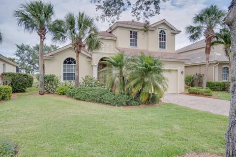 Tropical palms greet you as you arrive at this Mediterranean-style vacation home in a desirable gated community, with heated pool & golf course views.