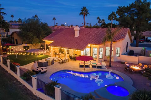 This home has it all-heated pool, spa, putting green, firepit, BBQ & ample seats