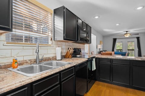Full kitchen with dishwasher, stove, oven and microwave.