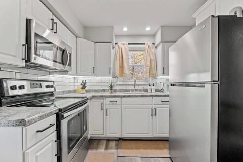 Fully equipped kitchen with a window, providing natural light and a pleasant cooking environment.