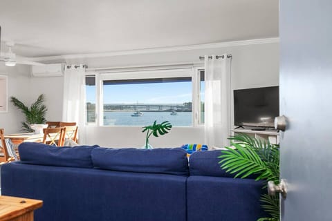 Open floorplan living and dining room with stunning views of mission bay