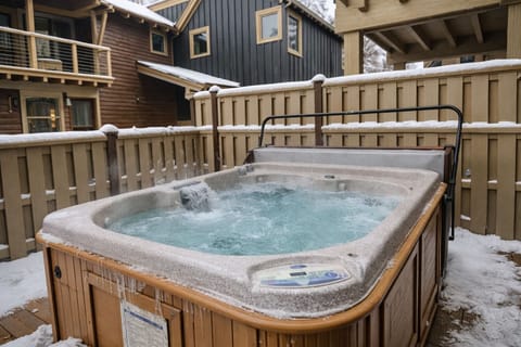 Escape to this cozy mountain retreat and unwind in the private hot tub surrounded by snow. The perfect end to a day of skiing or hiking!