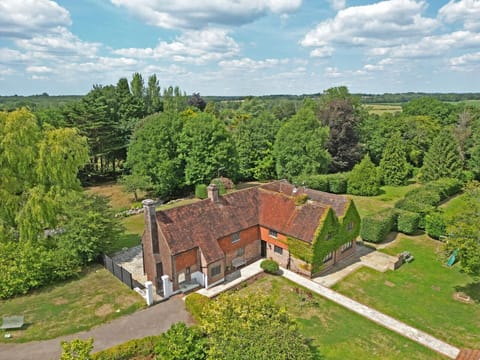 Aerial view of the manor and estate revealing the scale of the grounds and countryside beyond.