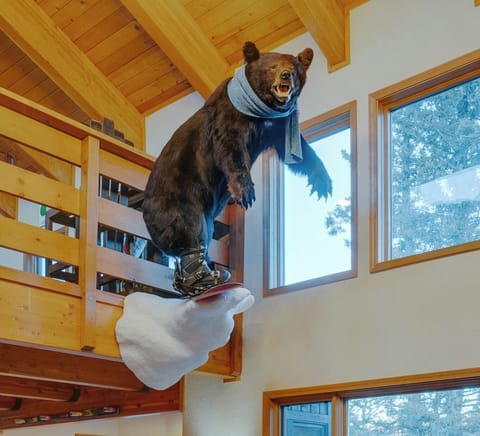"Shred" the snowboarding bear greeting guests as they walk in the living room 