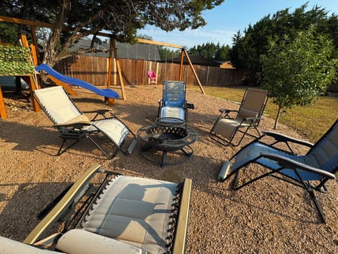 Solar light surrounding S'mores pit and seating next to Custom Tree-House!!