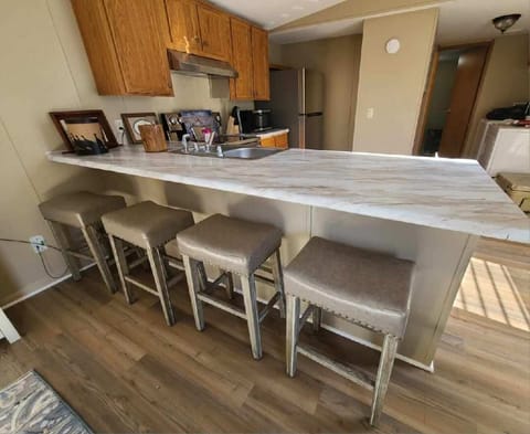 New bartop & stools that seats 4 comfortably. Cabin also has a table & chairs