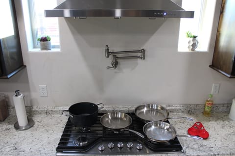 Five burner gas stove. Non stick, stainless steal and cast iron cookware