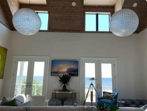 Vaulted wooden ceiling with windows overlooking the Gulf of Mexico