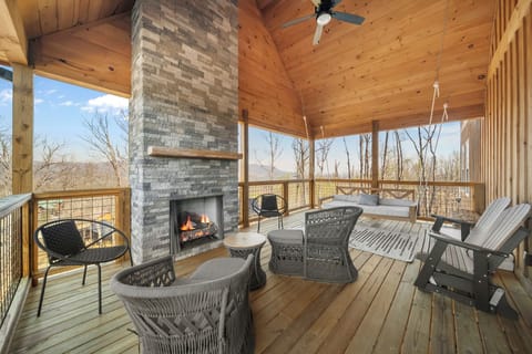 Covered porch with gas logs and a day bed