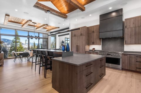 Kitchen into the Dining Room. Huge 6 burner gas stove with griddle and double ovens.
